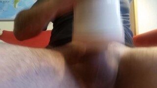 Guy moaning and shaking while cumming inside a fake pussy