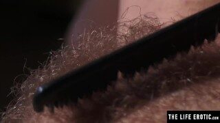 Watch this cute brunette soap up her hairy pussy in the shower